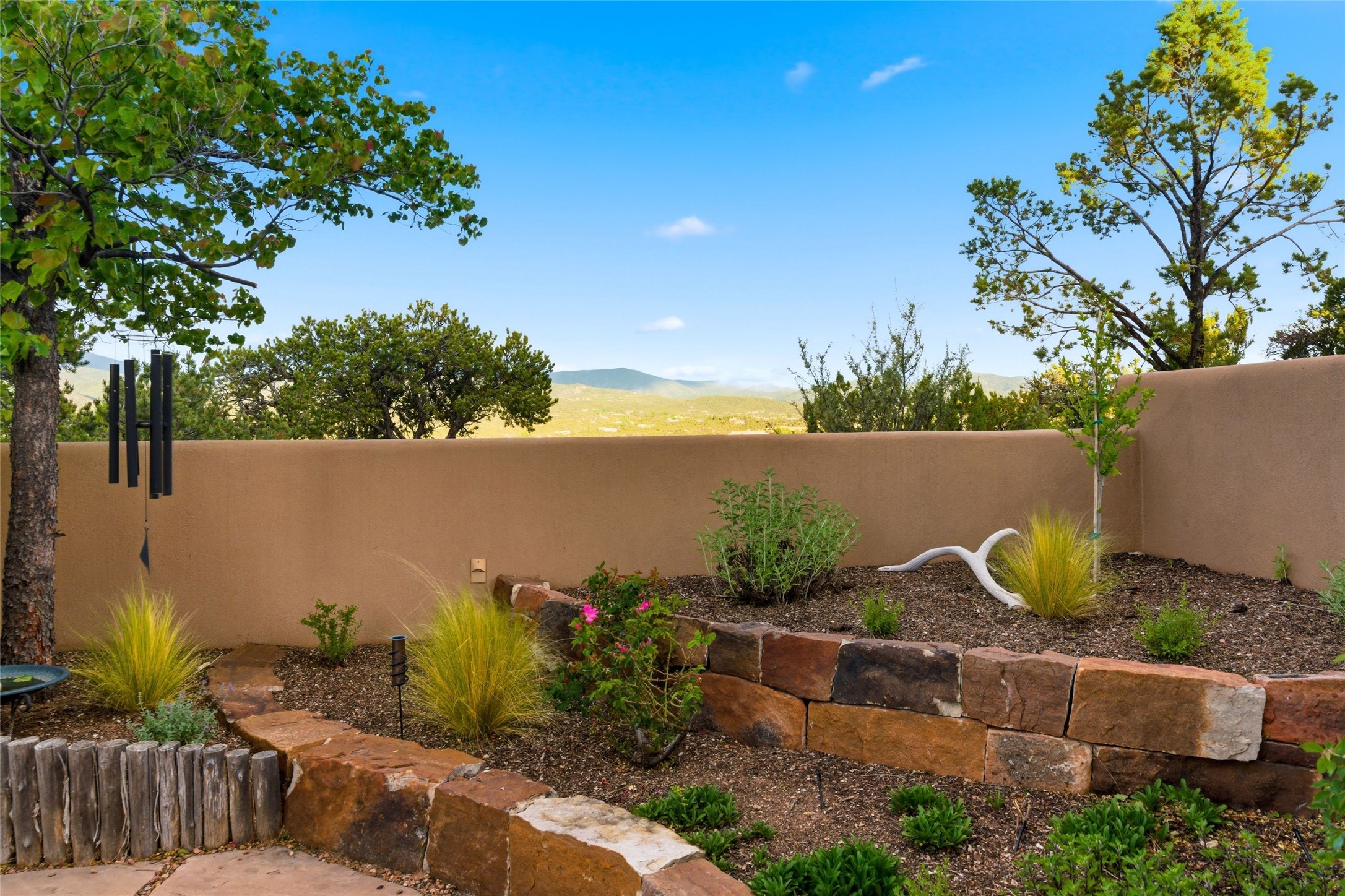 42 San Juan Ranch Road Santa Fe, NM 87506 - Photo 39 of 49 Well-landscaped, terraced gardens
