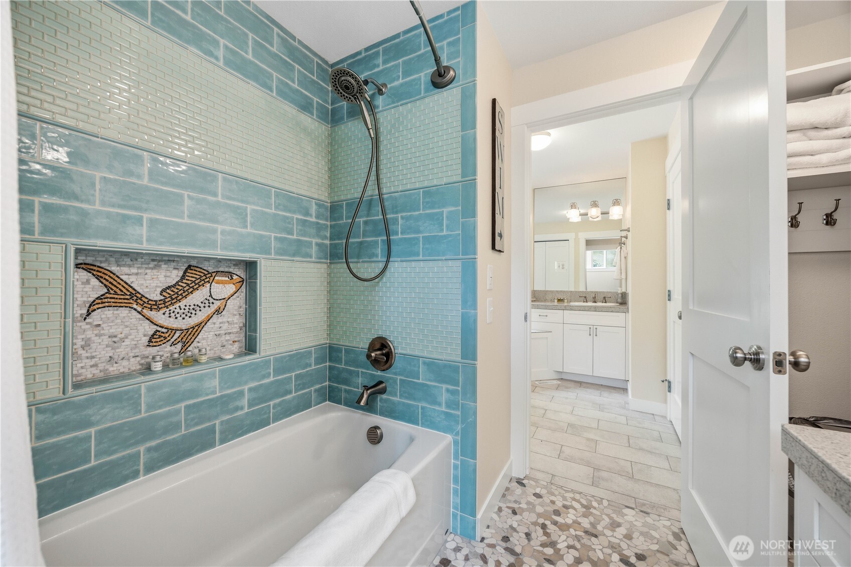 141 Sunset Place Manson, WA 98831 - Photo 20 of 38 a bathroom with a bathtub a shower and a sink