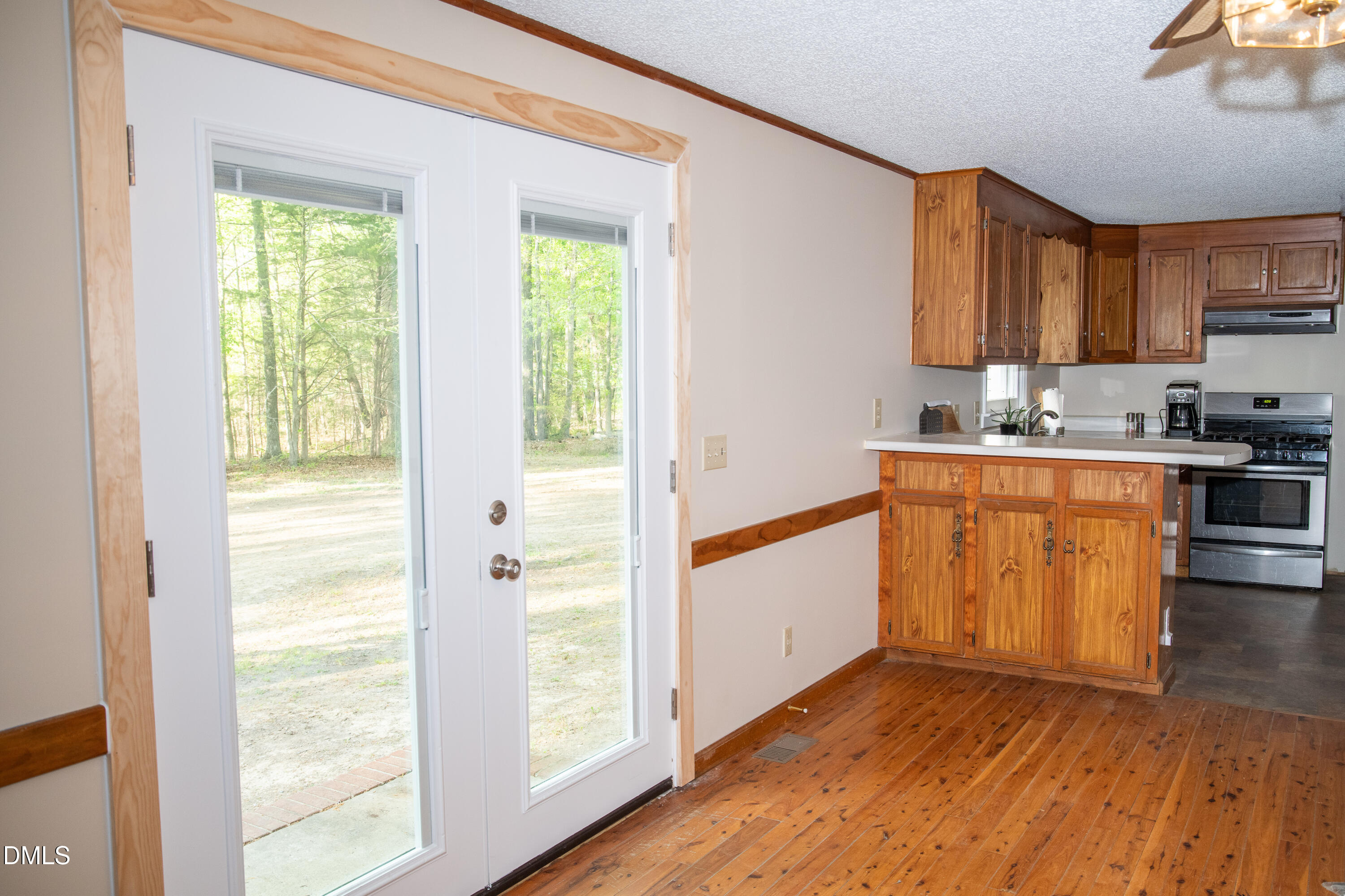 230 Hillsborough Road Timberlake, NC 27583 - Photo 8 of 15 a kitchen with a sink stove and cabinets
