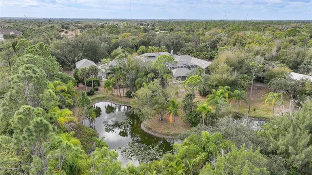a view of a lake and green valley