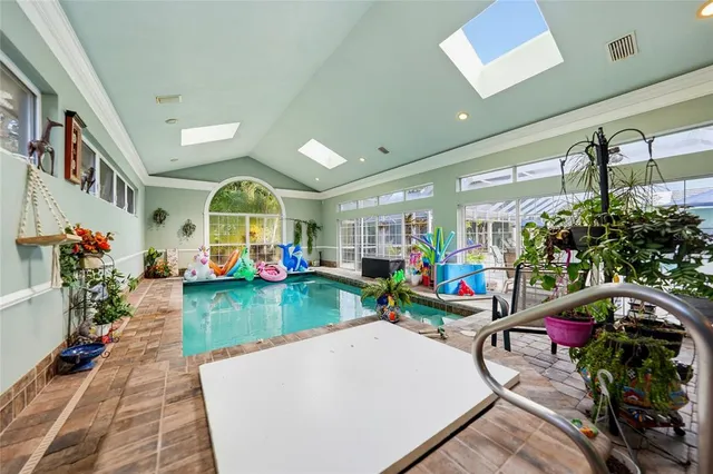 a bed room with a bed and a chair