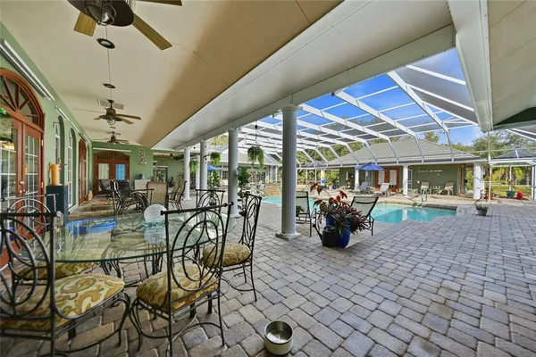 a view of a house with a yard porch and sitting area