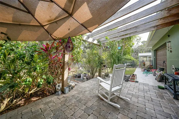 an aerial view of a house with garden space and street view