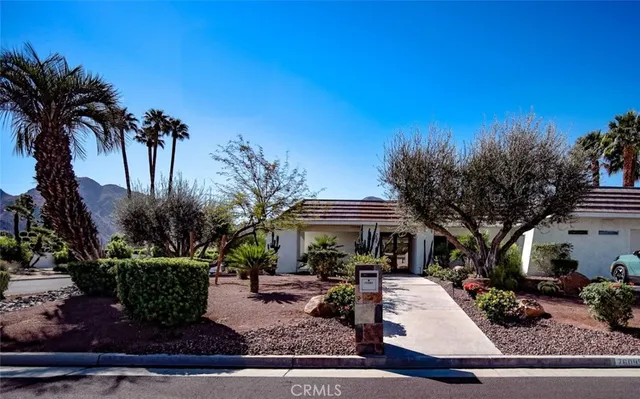 a side view of a house with a garage