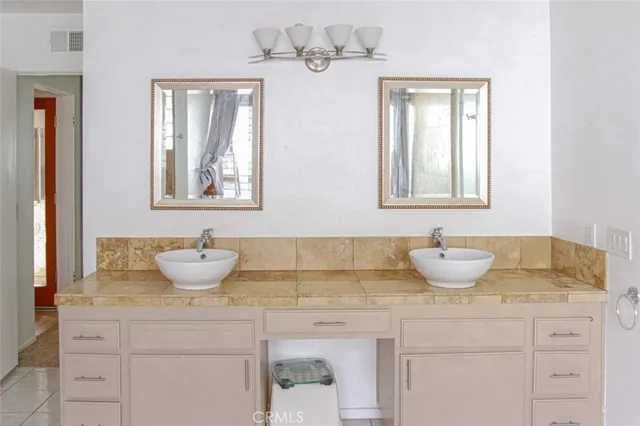 a view of living room with furniture and book shelf