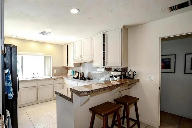 a kitchen with a sink cabinets and counter space