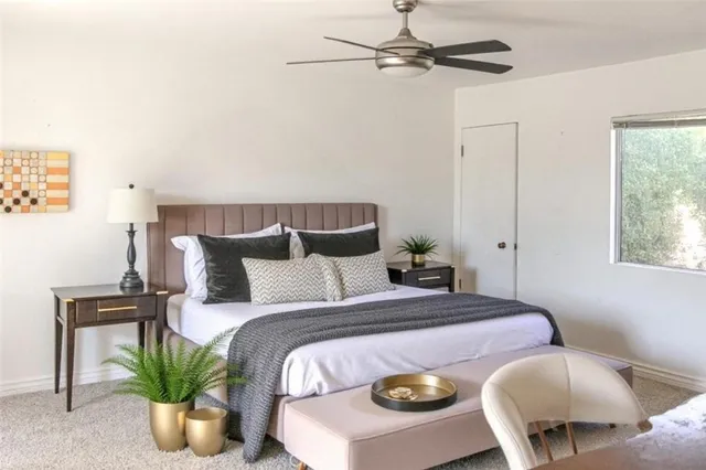 a bed room with bed and chair