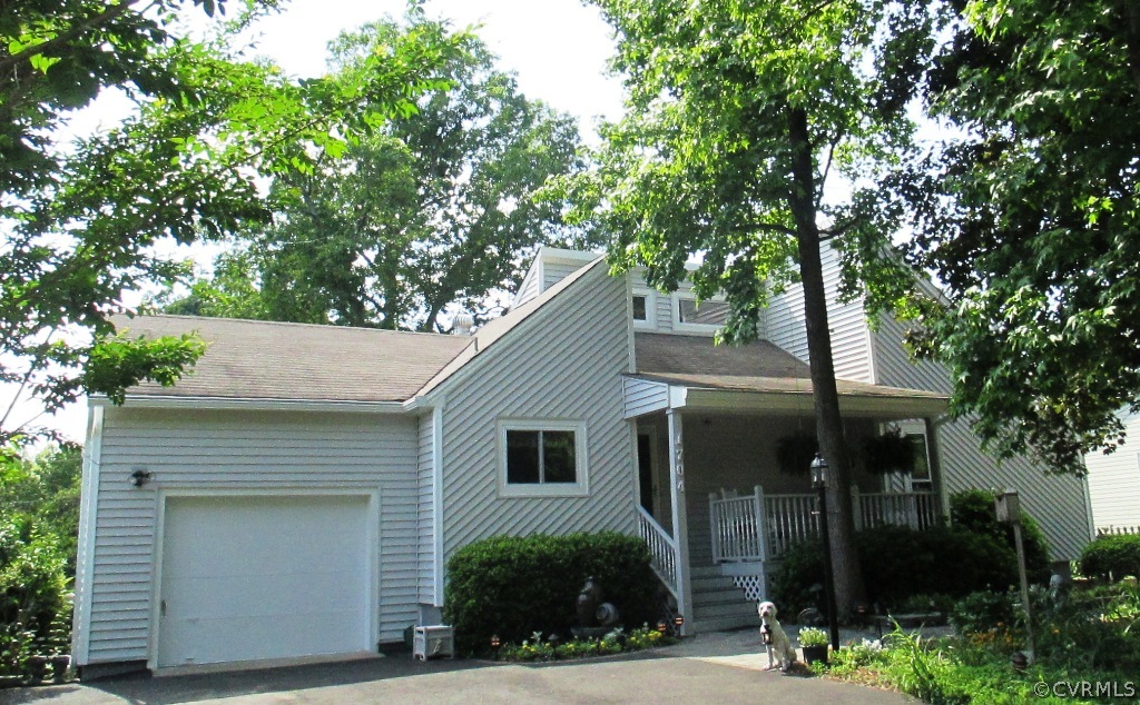a view of house and tree in front of it