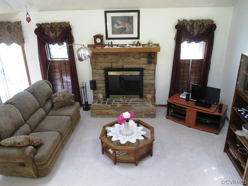 1704 Headwaters Road Midlothian, VA 23113 - Photo 4 of 22 a living room with furniture and a fireplace