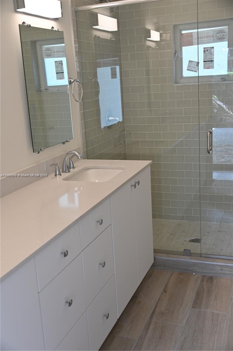 Granada Coral Gables, FL 33134 - Photo 7 of 13 a bathroom with a sink double vanity and a mirror