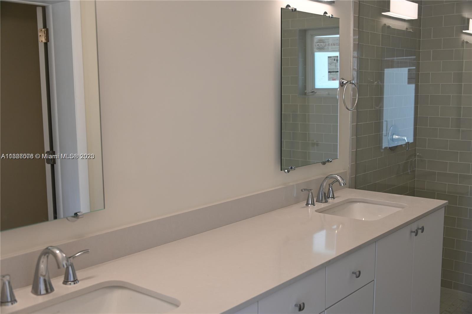 Granada Coral Gables, FL 33134 - Photo 8 of 13 a bathroom with a sink and a mirror