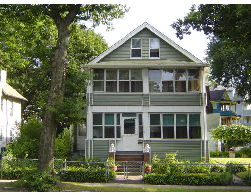 91-93 Orange Street Springfield, MA 01108 - Photo 1 of 17 a front view of a house with a yard