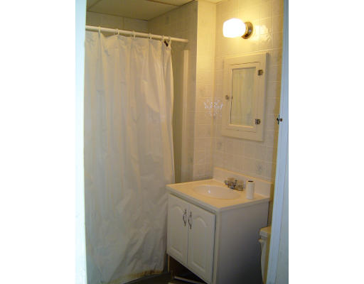 91-93 Orange Street Springfield, MA 01108 - Photo 16 of 17 a bathroom with a sink and a mirror