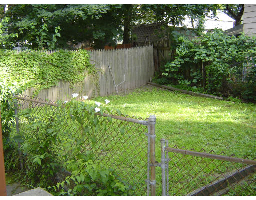 91-93 Orange Street Springfield, MA 01108 - Photo 3 of 17 a backyard of a house with lots of green space