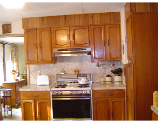 91-93 Orange Street Springfield, MA 01108 - Photo 7 of 17 a kitchen with stainless steel appliances granite countertop a stove and a microwave
