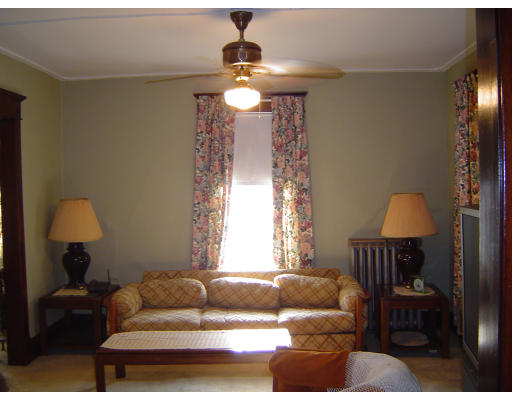 91-93 Orange Street Springfield, MA 01108 - Photo 8 of 17 a living room with furniture and a window