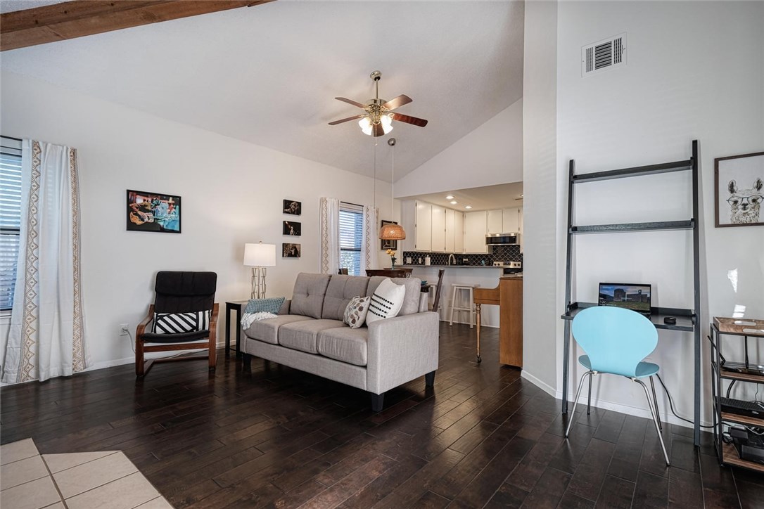 1748 Ohlen Road, Unit 74 Austin, TX 78757 - Photo 2 of 15 a living room with furniture and a wooden floor