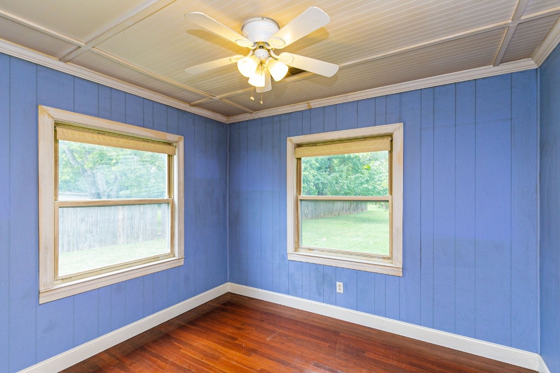 298 Franklin Road Lebanon, TN 37087 - Photo 13 of 34 a view of an empty room with a window and wooden floor