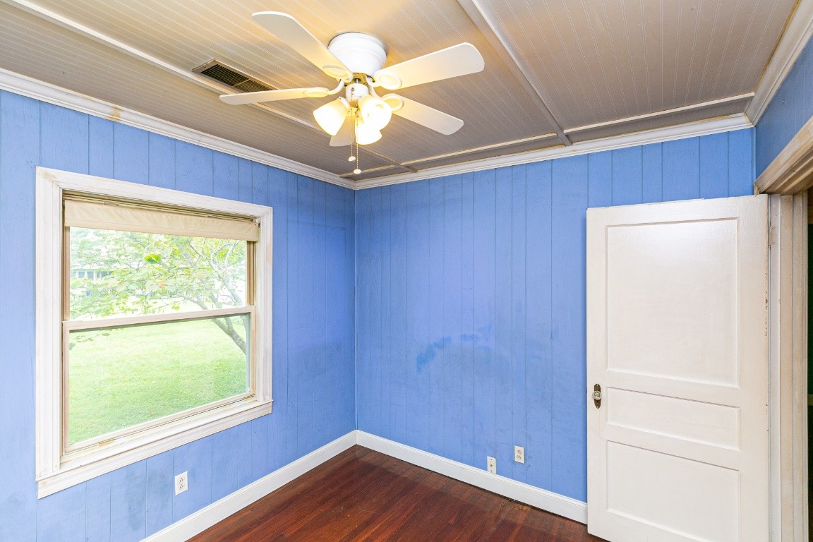 298 Franklin Road Lebanon, TN 37087 - Photo 15 of 34 a view of an empty room with a window and wooden floor