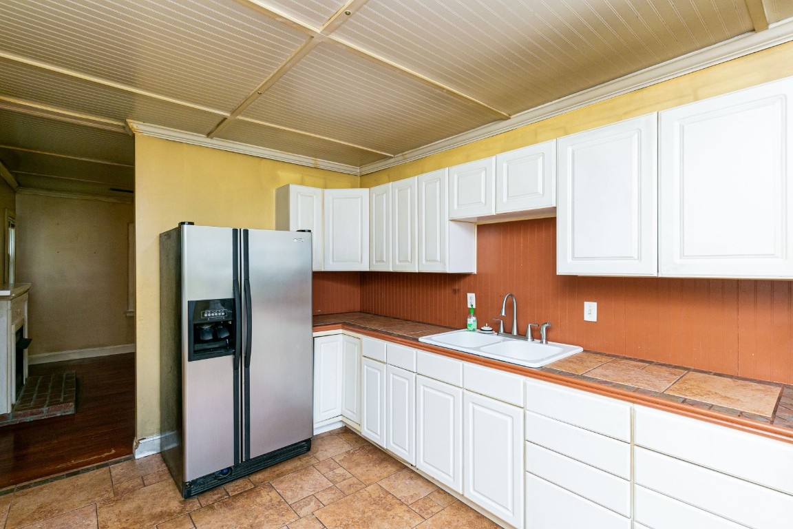 298 Franklin Road Lebanon, TN 37087 - Photo 24 of 34 a kitchen with stainless steel appliances granite countertop a refrigerator sink and cabinets