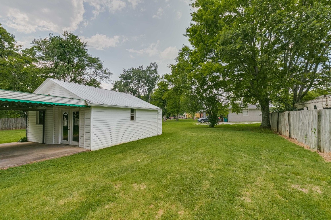298 Franklin Road Lebanon, TN 37087 - Photo 34 of 34 a front view of a house with a garden and trees