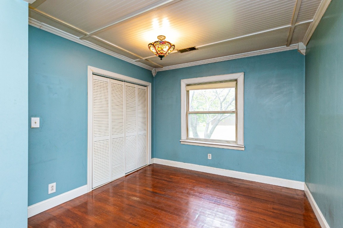 298 Franklin Road Lebanon, TN 37087 - Photo 10 of 34 an empty room with wooden floor chandelier and windows