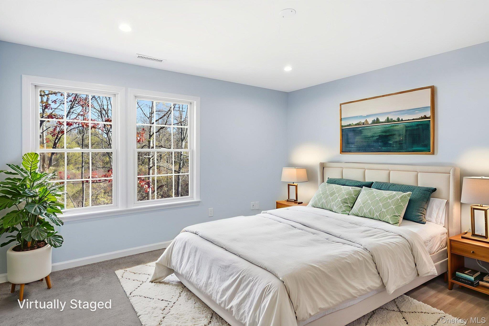 40 Cushman Road Patterson, NY 12563 - Photo 28 of 40 a bedroom with a large bed and a potted plant