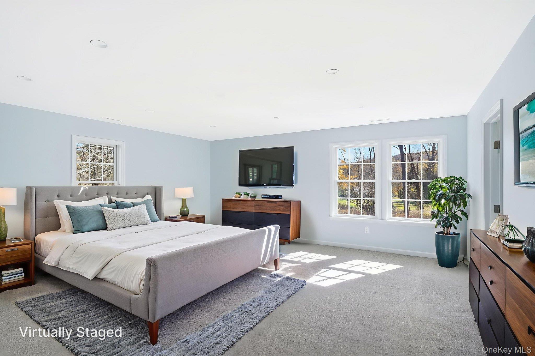 40 Cushman Road Patterson, NY 12563 - Photo 31 of 40 a bedroom with a bed and a flat screen tv