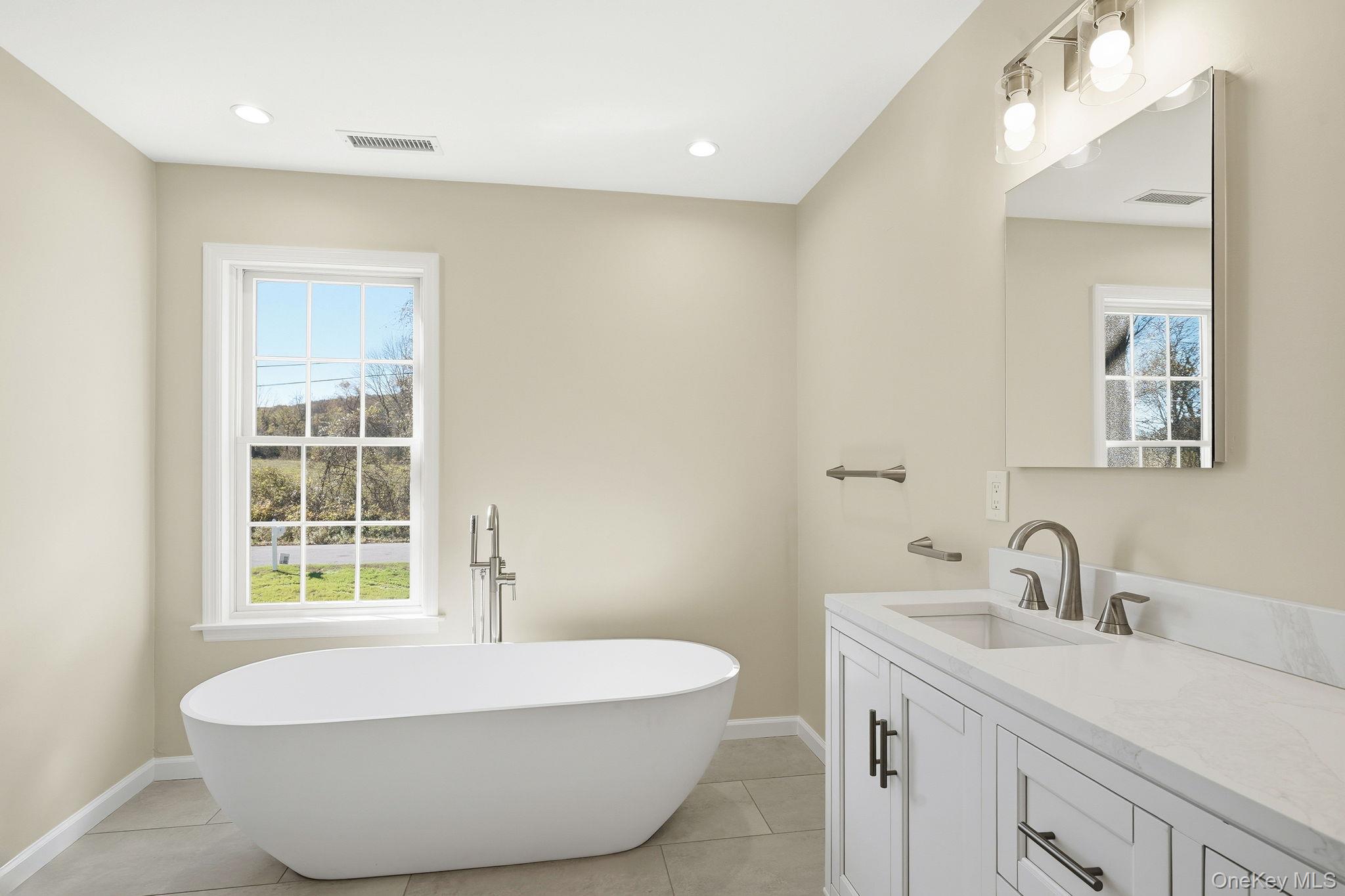 40 Cushman Road Patterson, NY 12563 - Photo 34 of 40 a bathroom with a sink and a bathtub