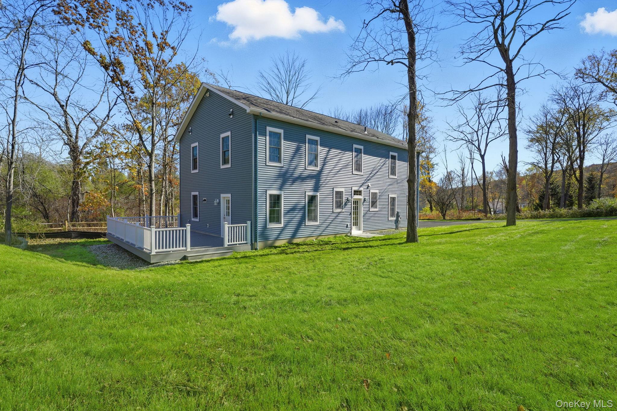 40 Cushman Road Patterson, NY 12563 - Photo 4 of 40 a view of a house with backyard and garden