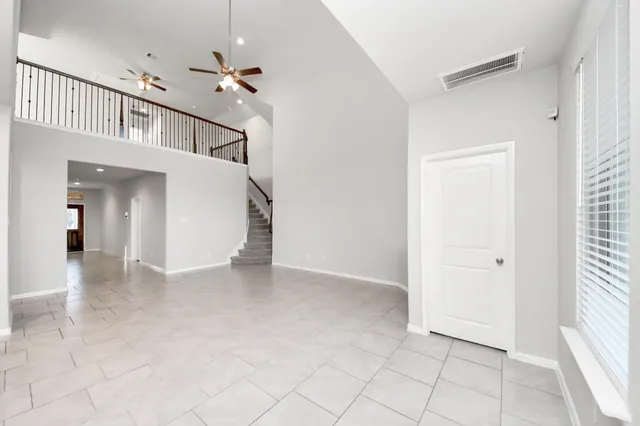 a view of a hallway with staircase