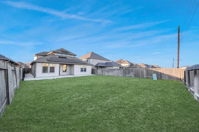 a view of a house with a big yard