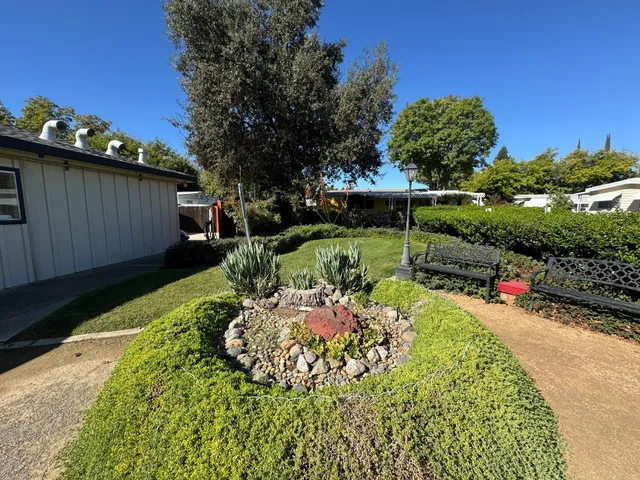 a garden view with a seating space