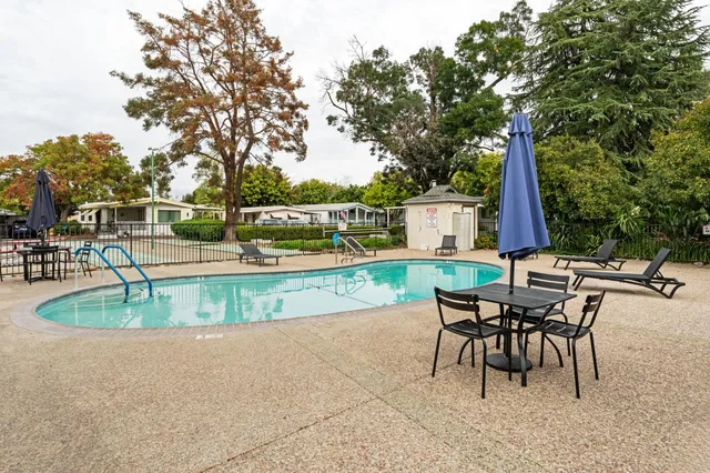 a view of a backyard with a patio