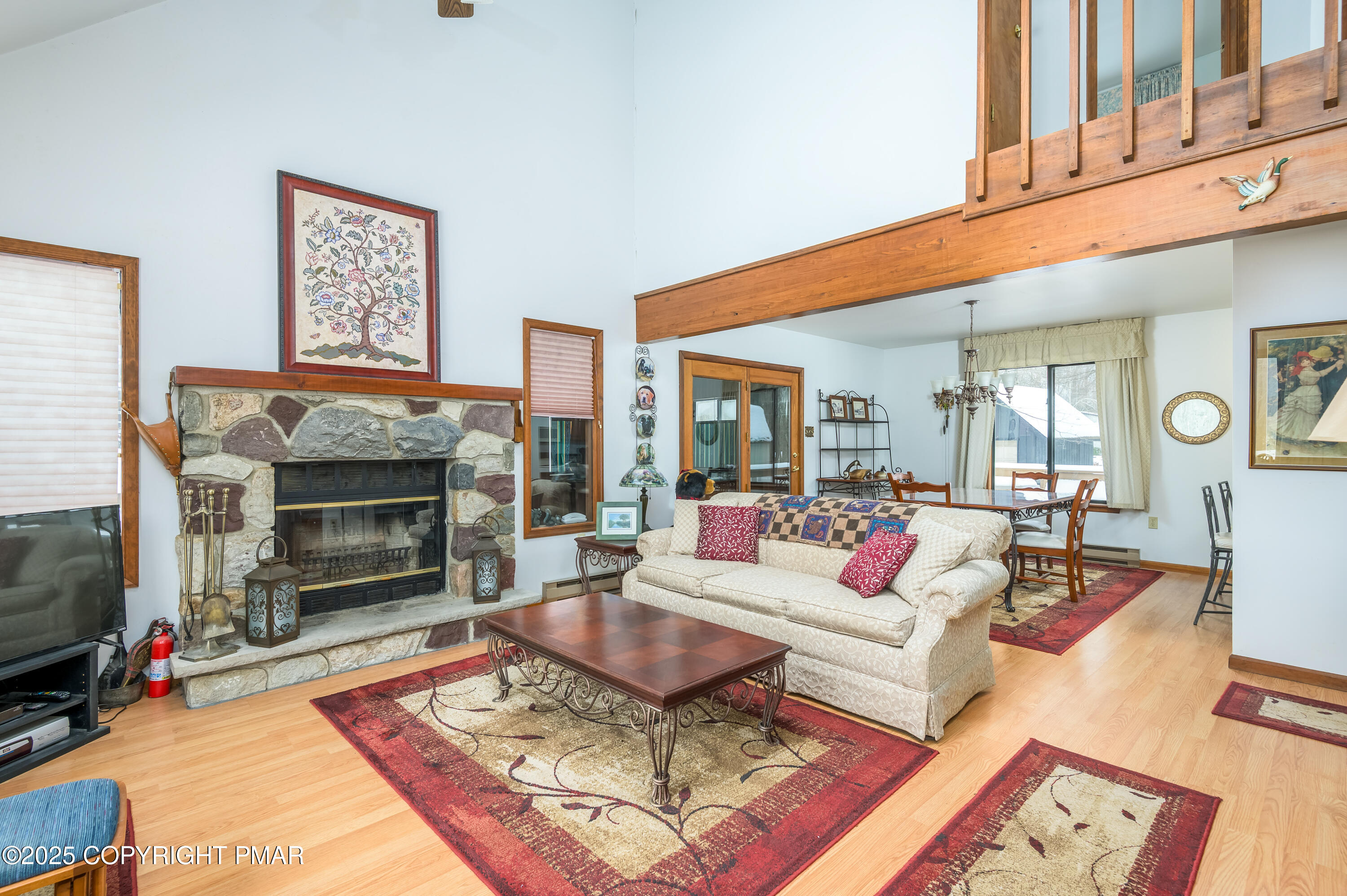 233 Pontiac Path Pocono Lake, PA 18347 - Photo 11 of 46 a living room with furniture a flat screen tv and a fireplace