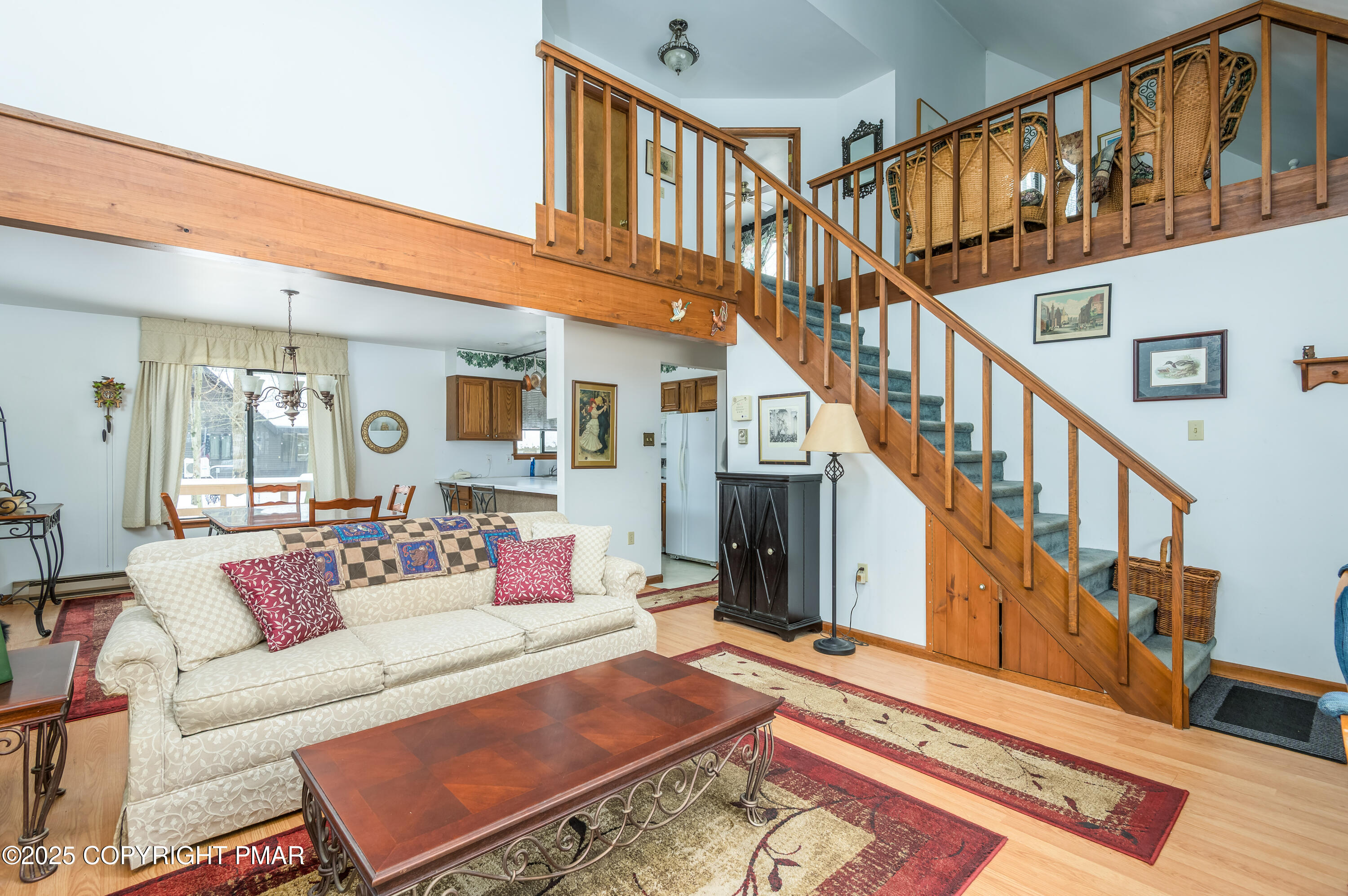 233 Pontiac Path Pocono Lake, PA 18347 - Photo 12 of 46 a living room with stairs and a rug
