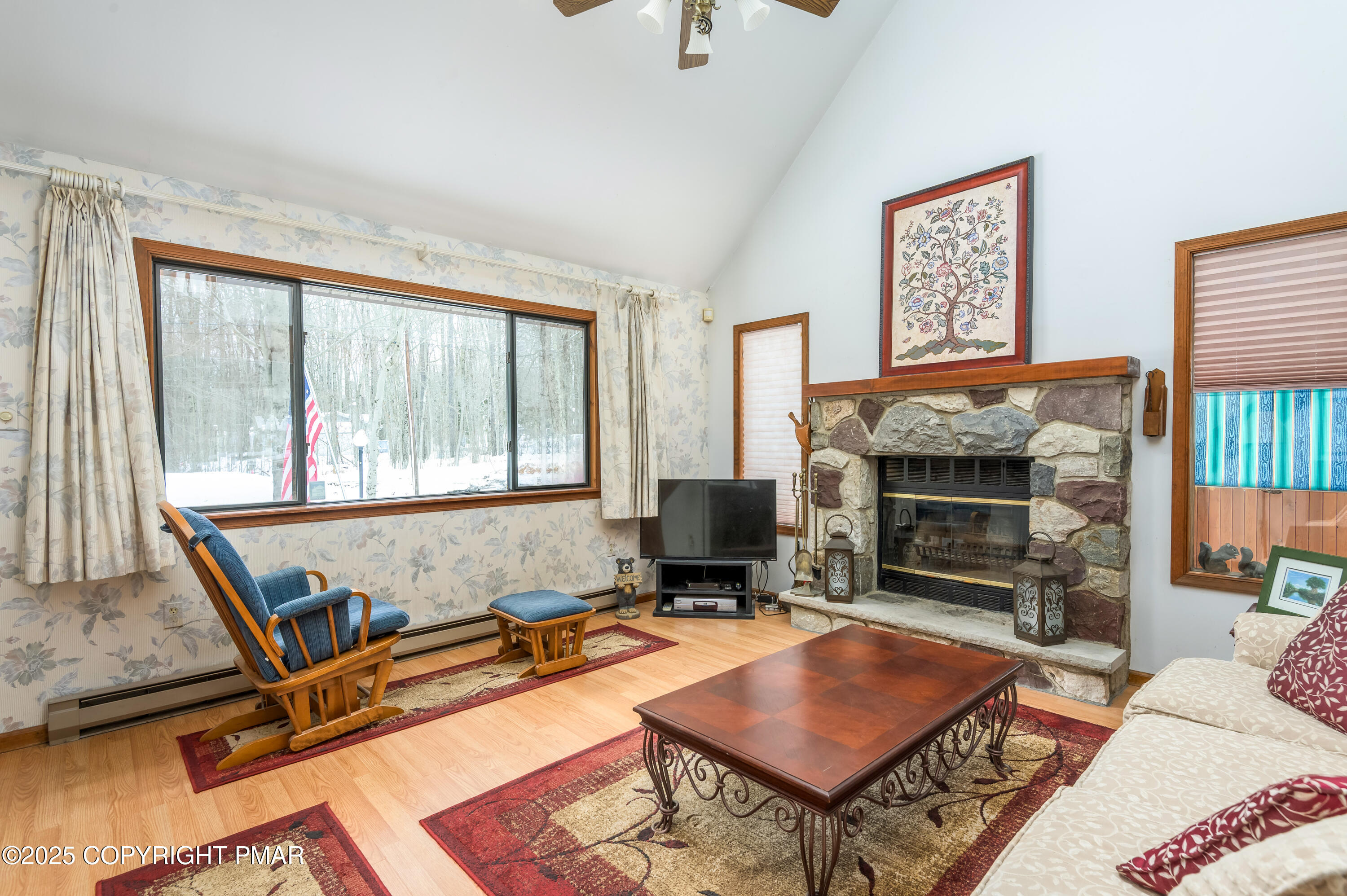 233 Pontiac Path Pocono Lake, PA 18347 - Photo 14 of 46 a living room with furniture a flat screen tv and a fireplace