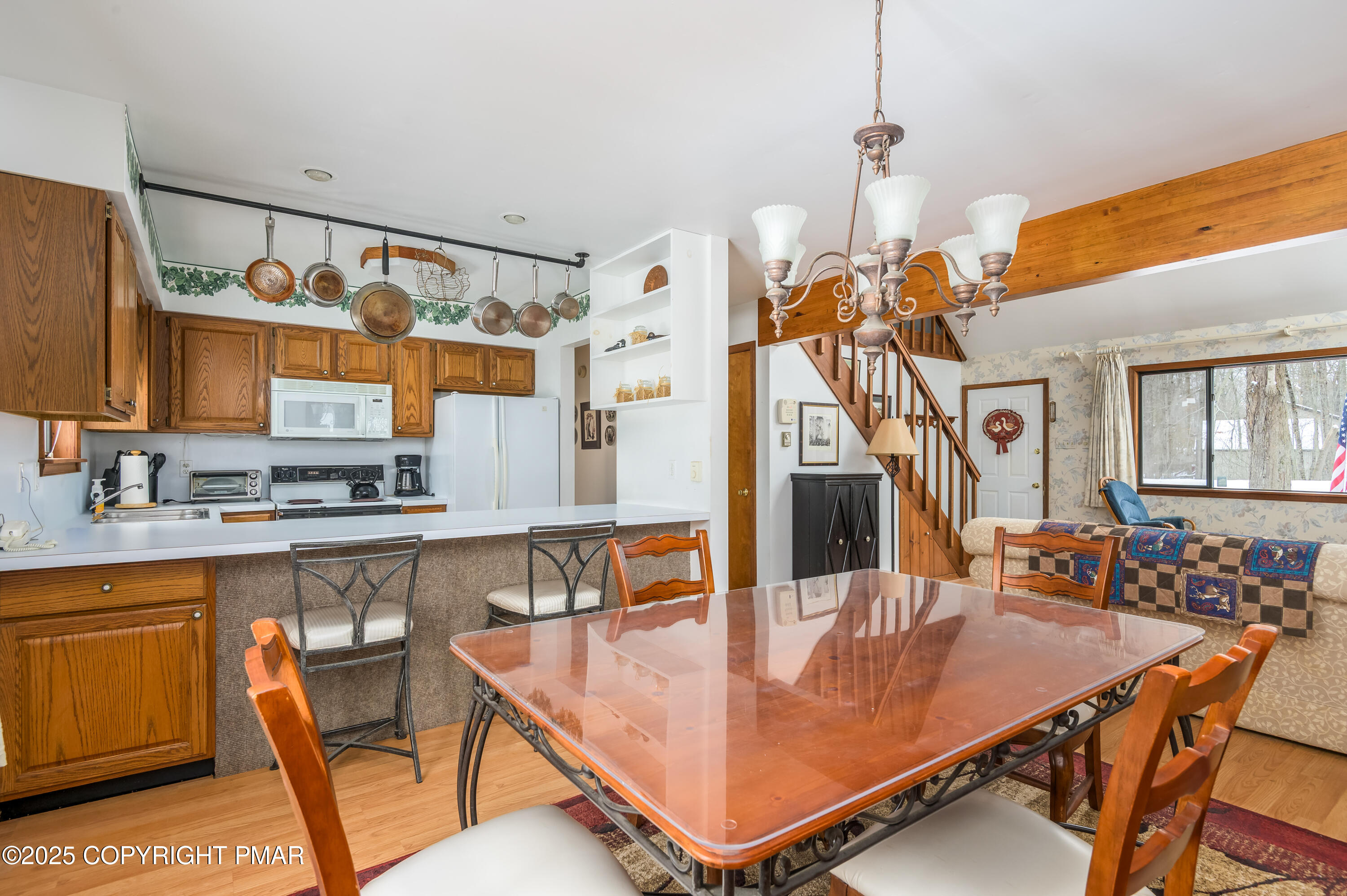 233 Pontiac Path Pocono Lake, PA 18347 - Photo 16 of 46 a dining room filled with furniture and view of kitchen