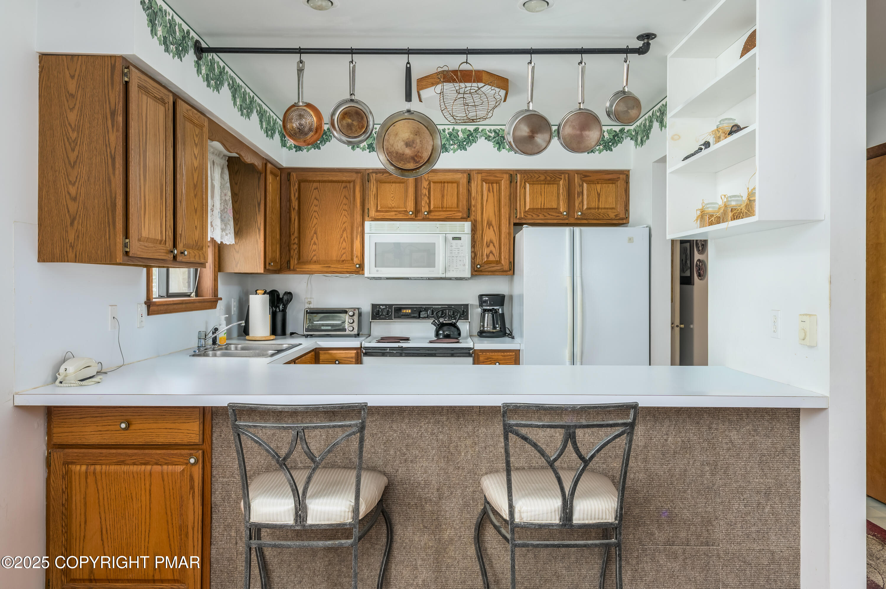 233 Pontiac Path Pocono Lake, PA 18347 - Photo 17 of 46 a kitchen with stainless steel appliances granite countertop a sink and a refrigerator