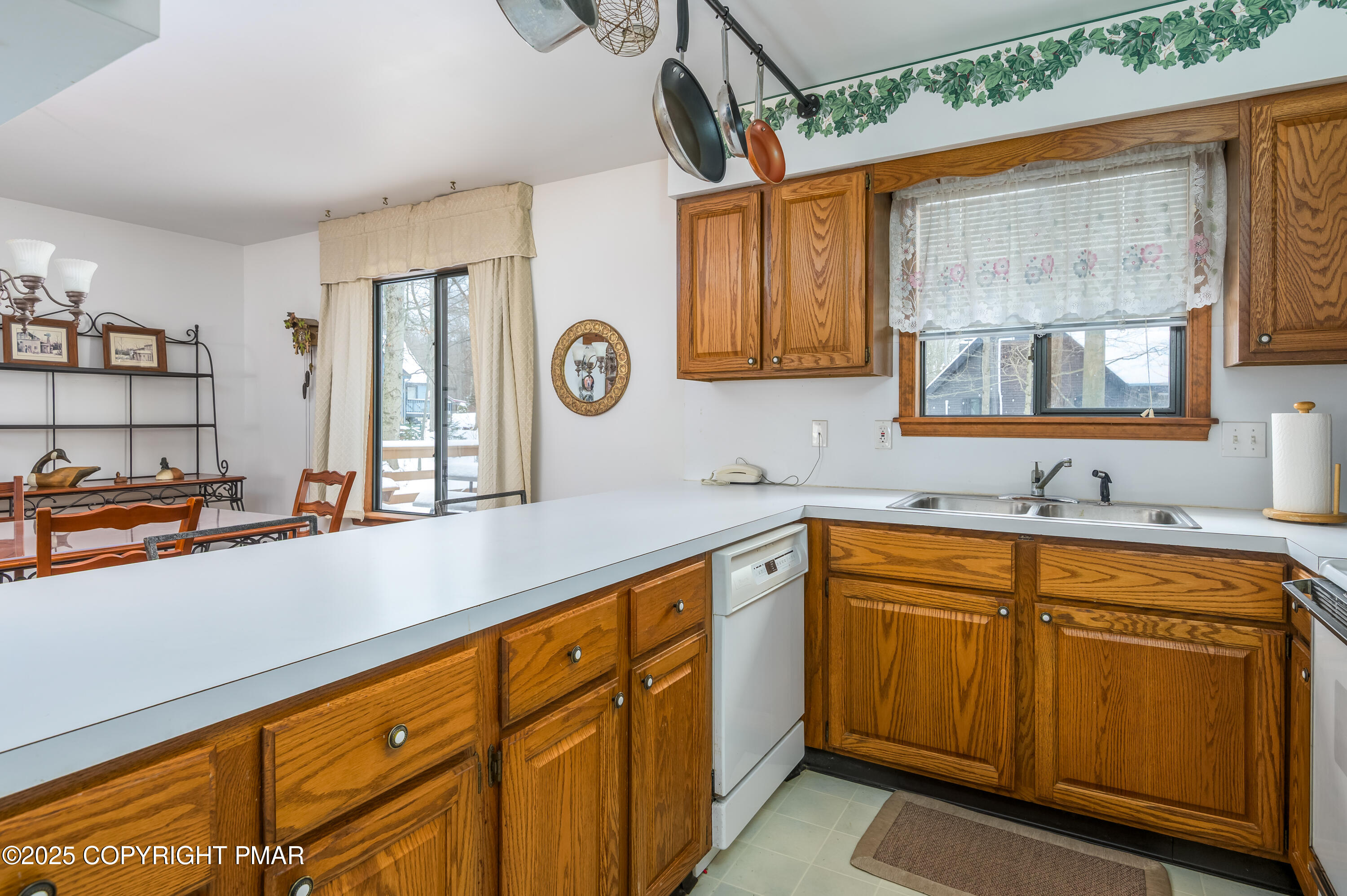 233 Pontiac Path Pocono Lake, PA 18347 - Photo 19 of 46 a kitchen with cabinets and window