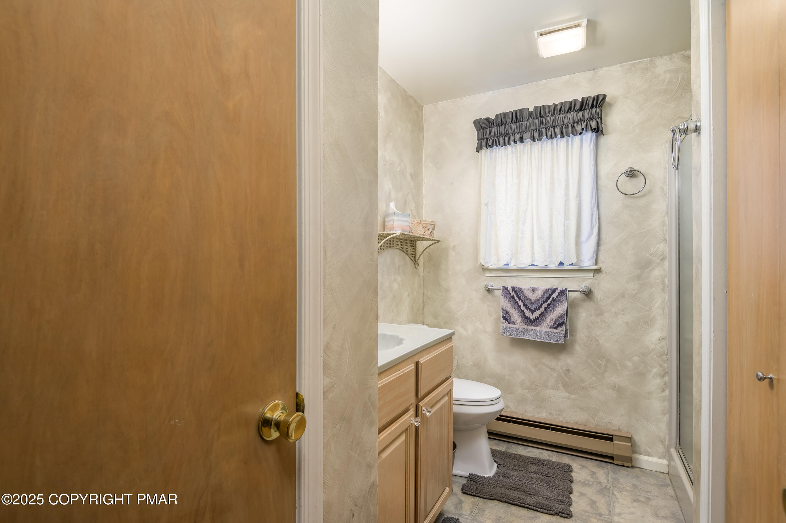 233 Pontiac Path Pocono Lake, PA 18347 - Photo 23 of 46 a bathroom with a granite countertop sink toilet and shower