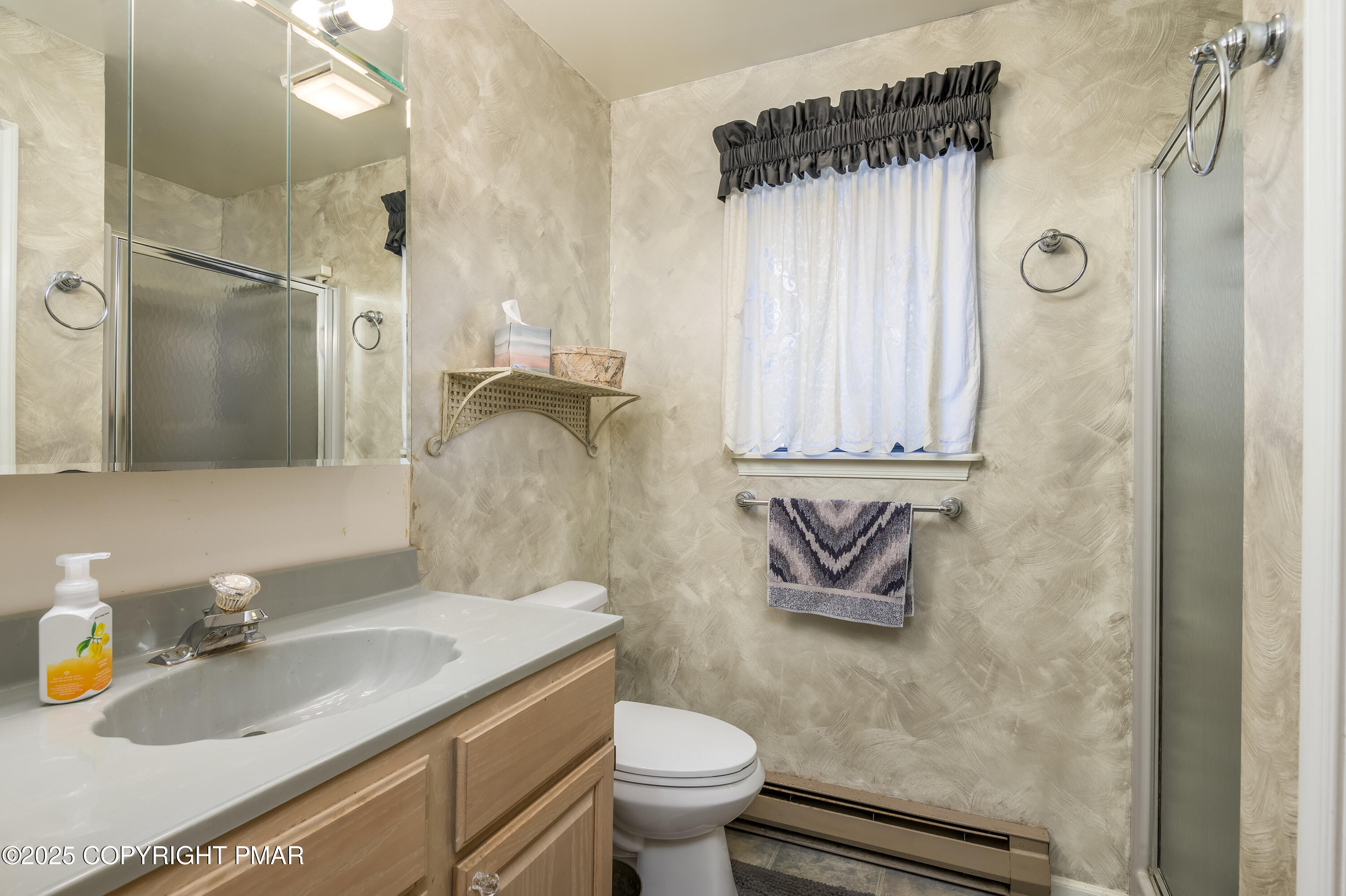 233 Pontiac Path Pocono Lake, PA 18347 - Photo 24 of 46 a bathroom with a granite countertop sink toilet and shower