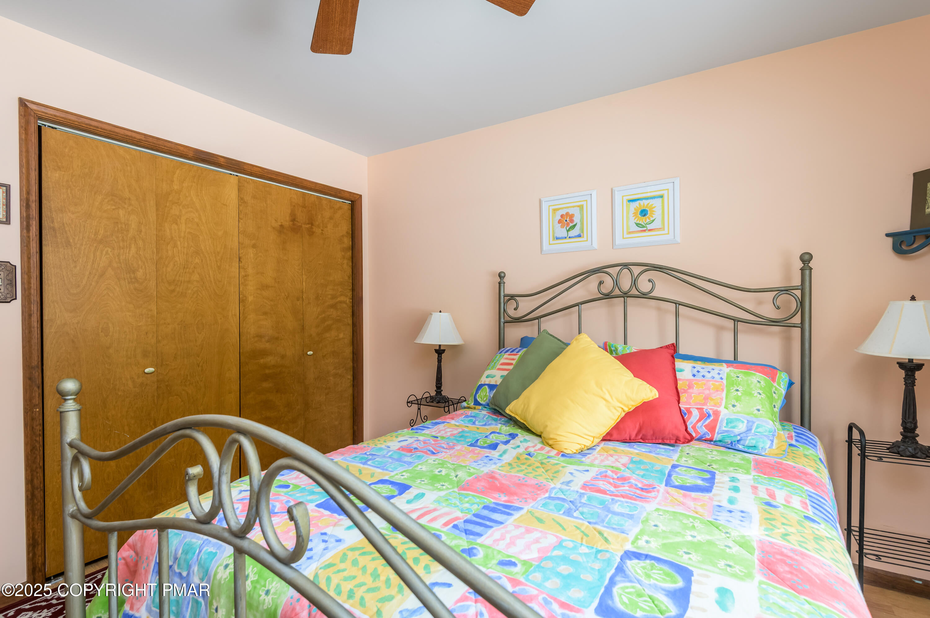 233 Pontiac Path Pocono Lake, PA 18347 - Photo 27 of 46 a bedroom with a bed next to a window
