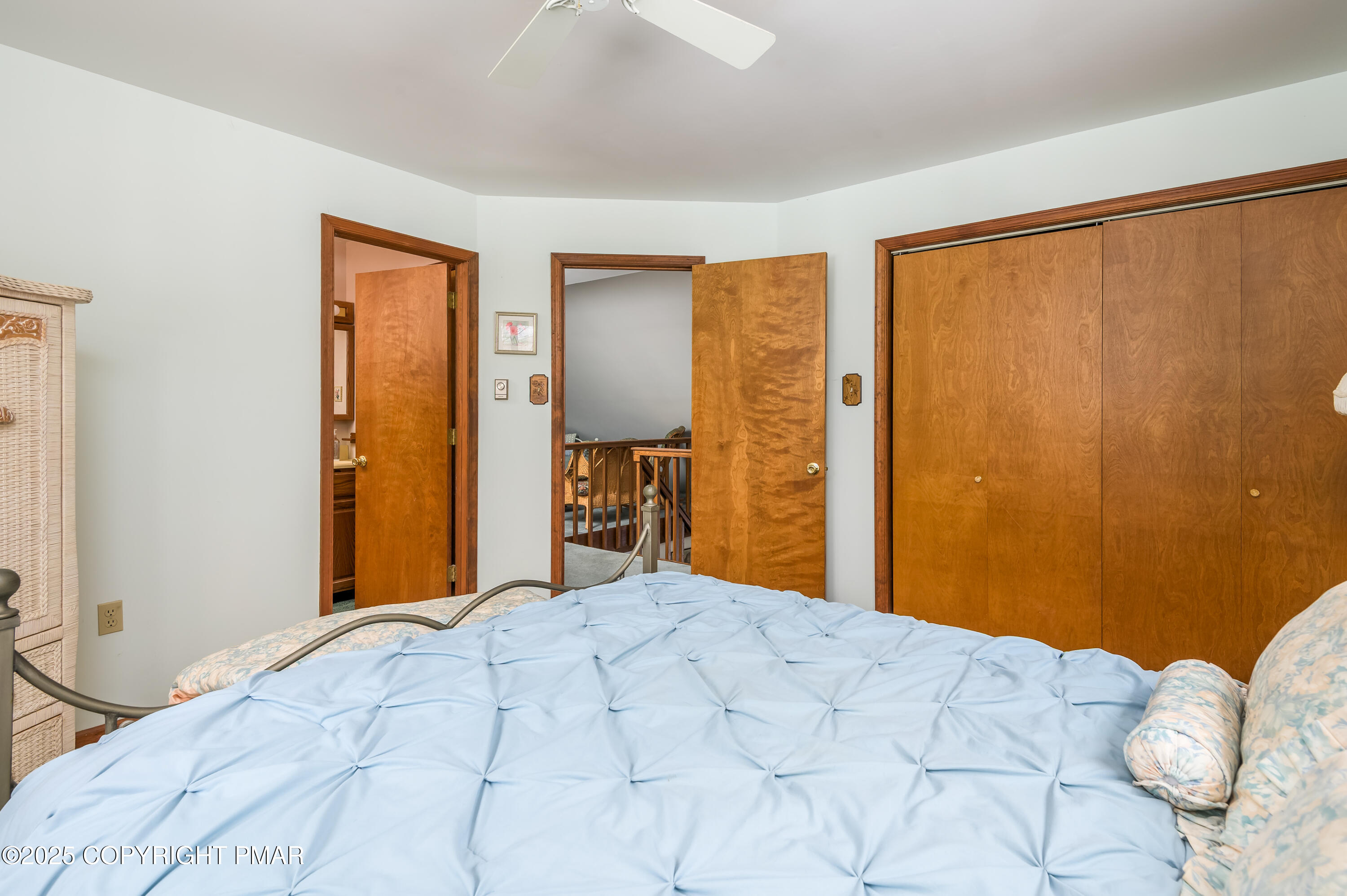 233 Pontiac Path Pocono Lake, PA 18347 - Photo 29 of 46 a bedroom with a bed and mirror
