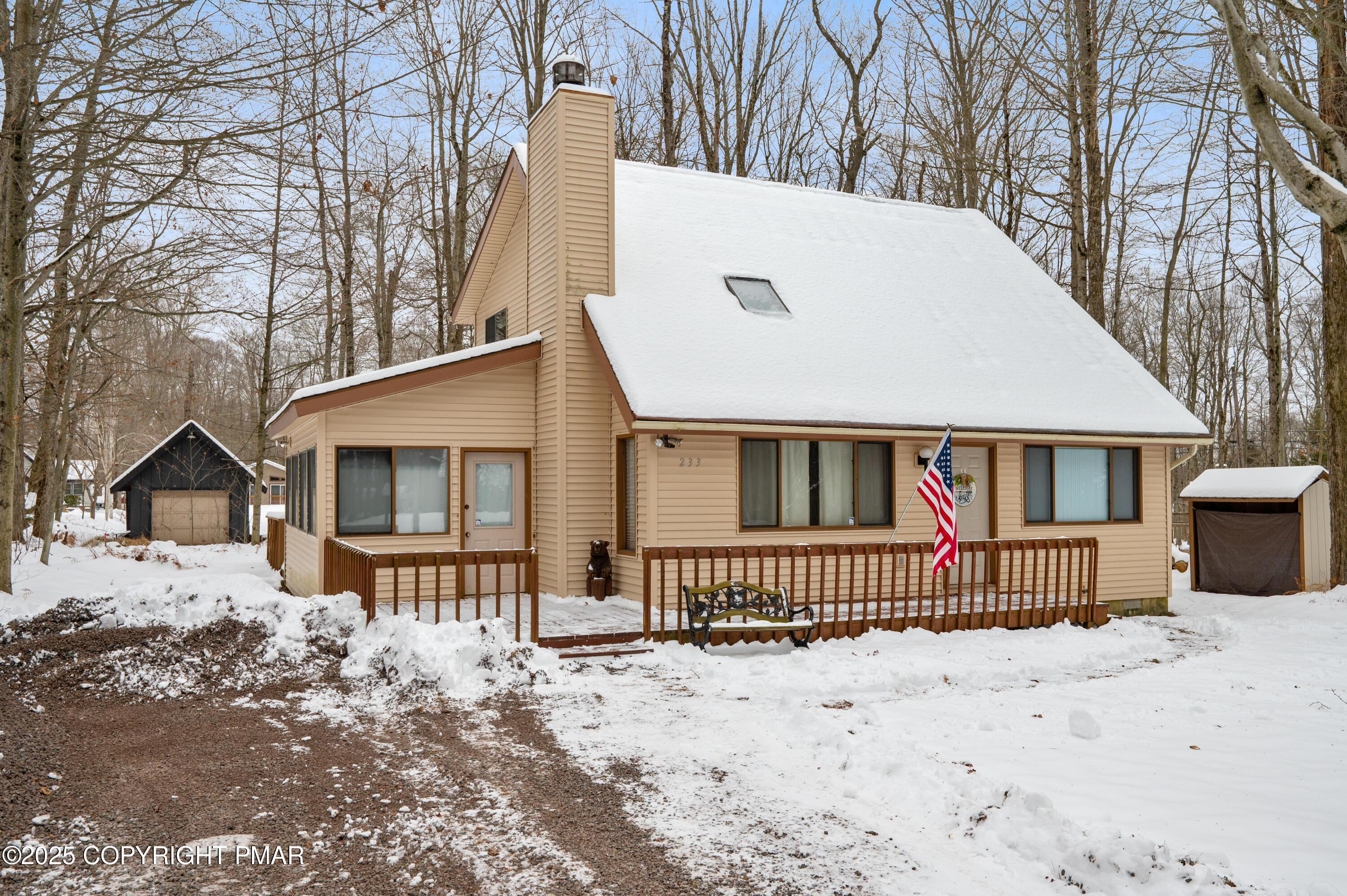 233 Pontiac Path Pocono Lake, PA 18347 - Photo 3 of 46 a front view of a house with a yard