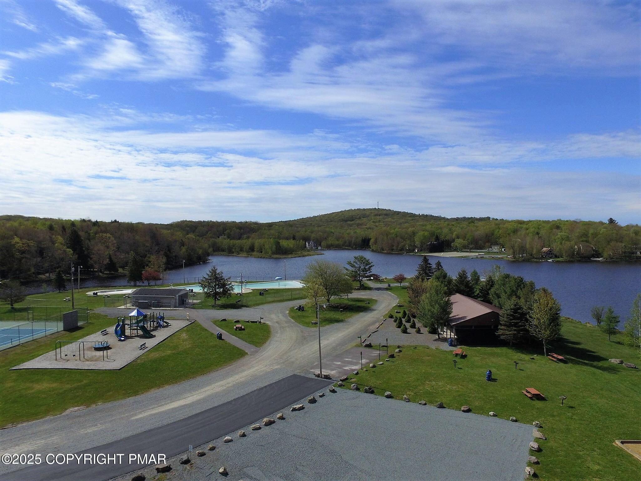 233 Pontiac Path Pocono Lake, PA 18347 - Photo 37 of 46 a view of a lake with a yard