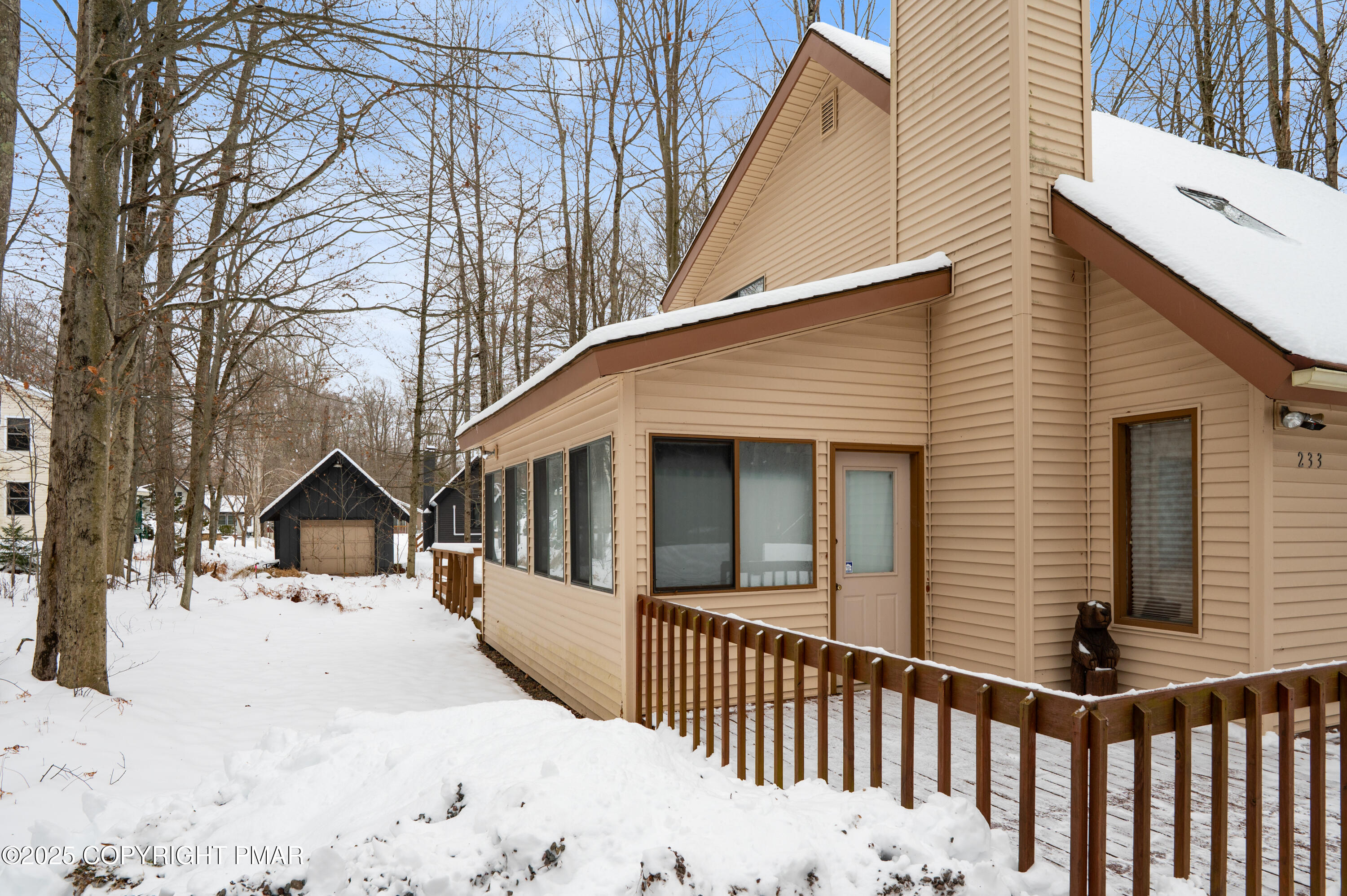 233 Pontiac Path Pocono Lake, PA 18347 - Photo 4 of 46 a view of house with a yard covered in snow