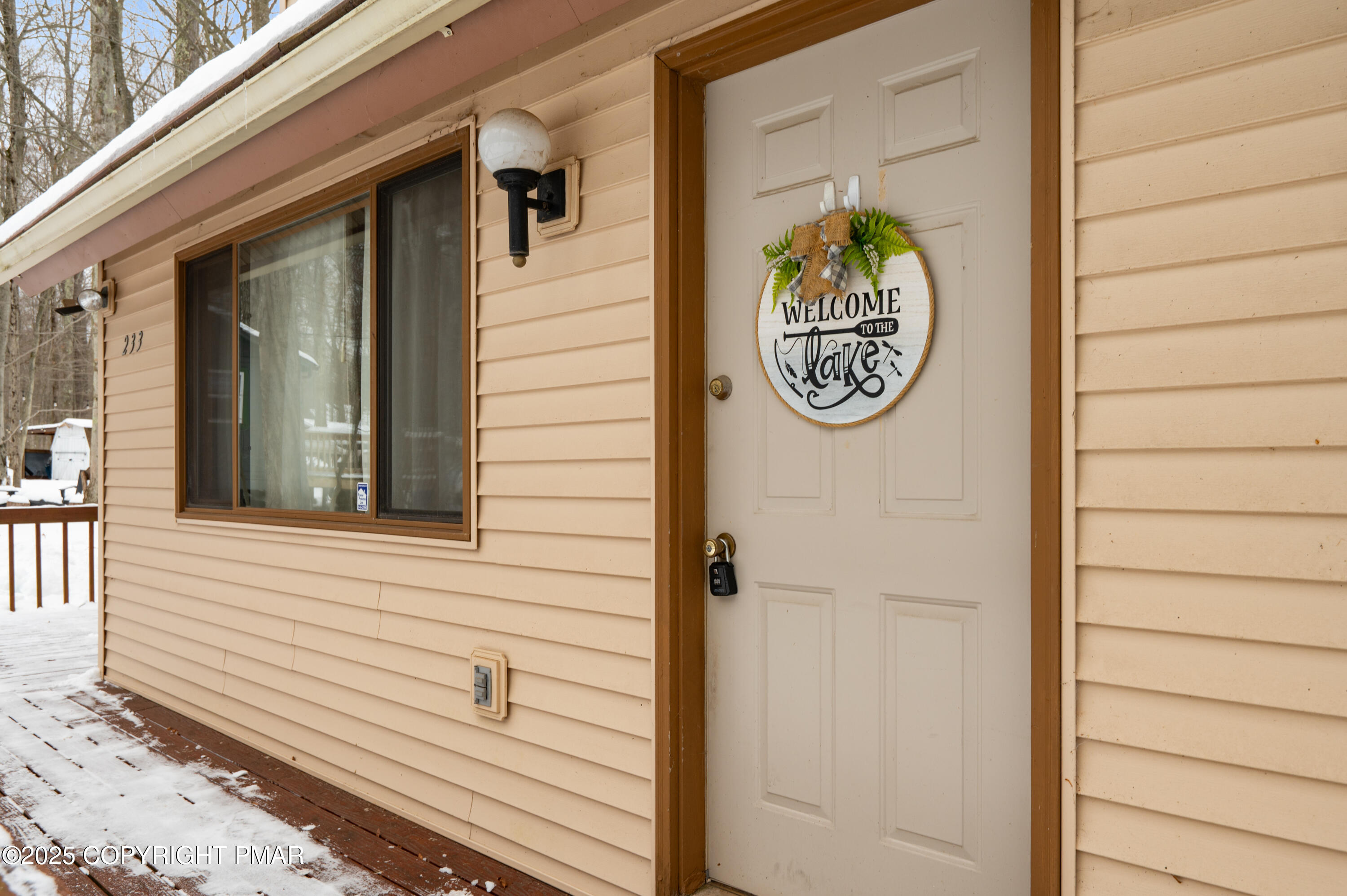 233 Pontiac Path Pocono Lake, PA 18347 - Photo 10 of 46 a view of a entryway door front of house