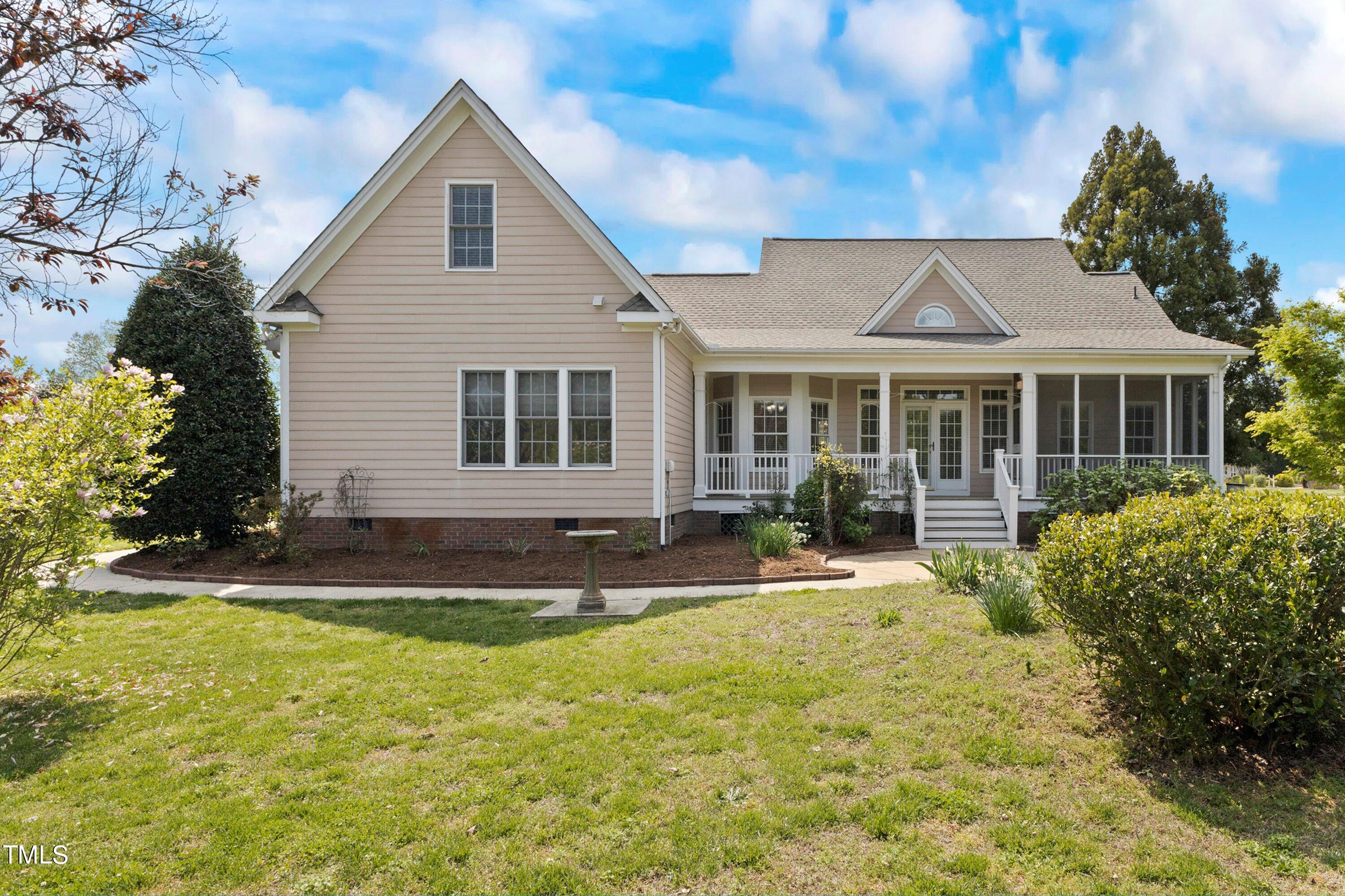 1004 Pasture View Lane Raleigh, NC 27603 - Photo 41 of 48 Back of the home. Covered and screened porch and patio area.