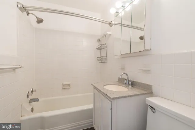 a bathroom with a sink a mirror and a shower